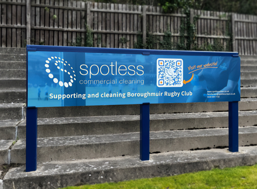 Spotless Commercial Cleaning Ltd sponsorship board at Boroughmuir Rugby Club in 2024.